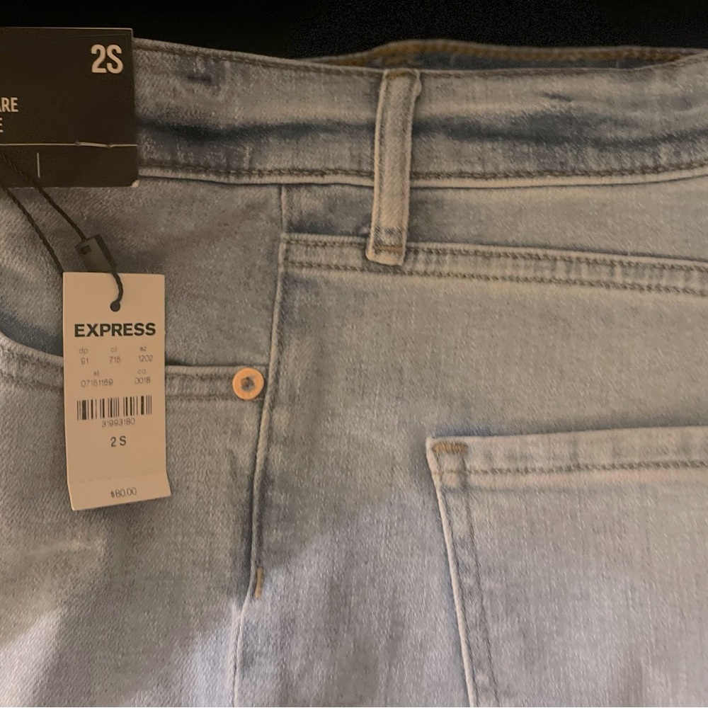 Flared light washed color Express jeans.